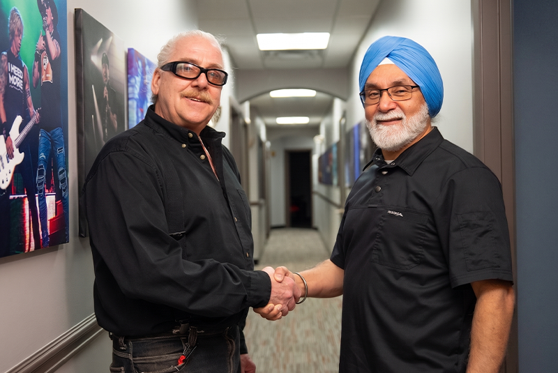 Dr. Bath and patient shaking hands in the hallway